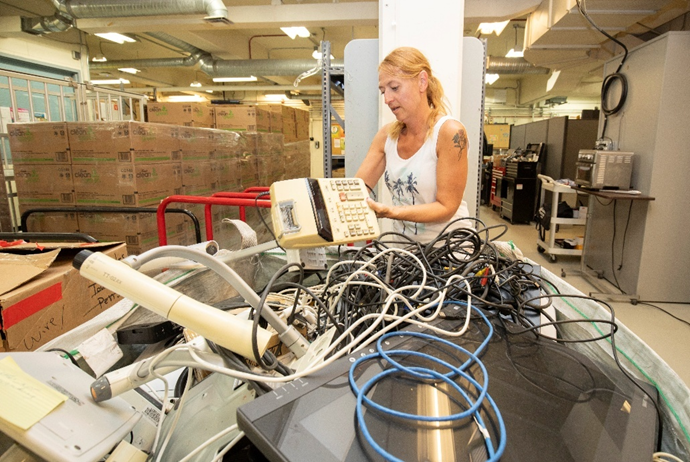 a worker sorting e-waste