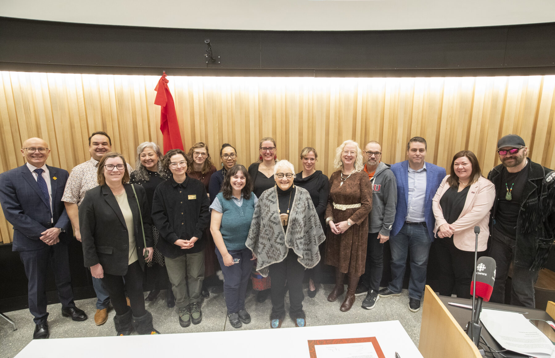 Several people posing for a group photo