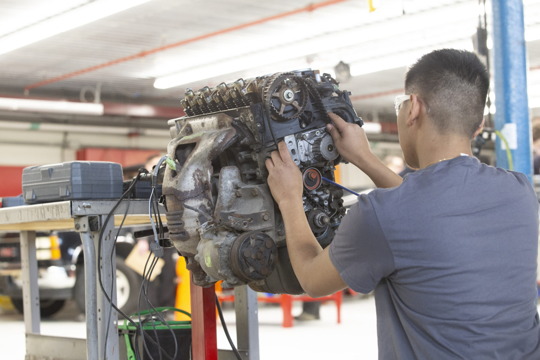 a mechanic fixing a car engine