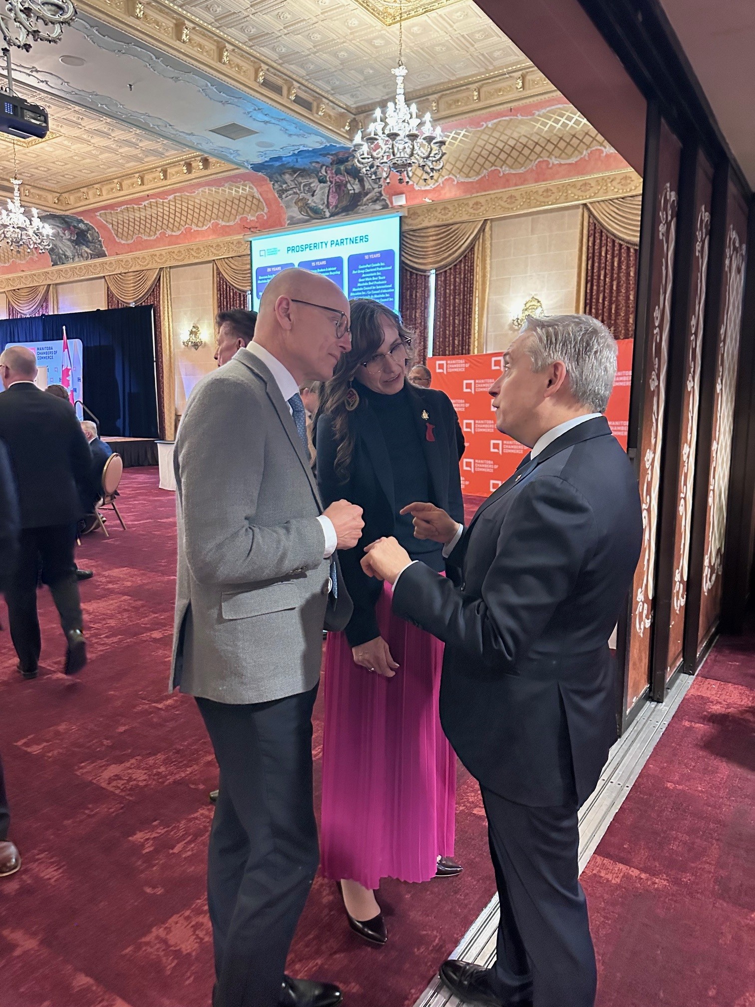RRC Polytech President and CEO, Fred Meier, and the Honourable Renée Cable, Minister of Advanced Education and Training speak with speak with Canada’s Minister of Finance, François-Philippe Champagne 