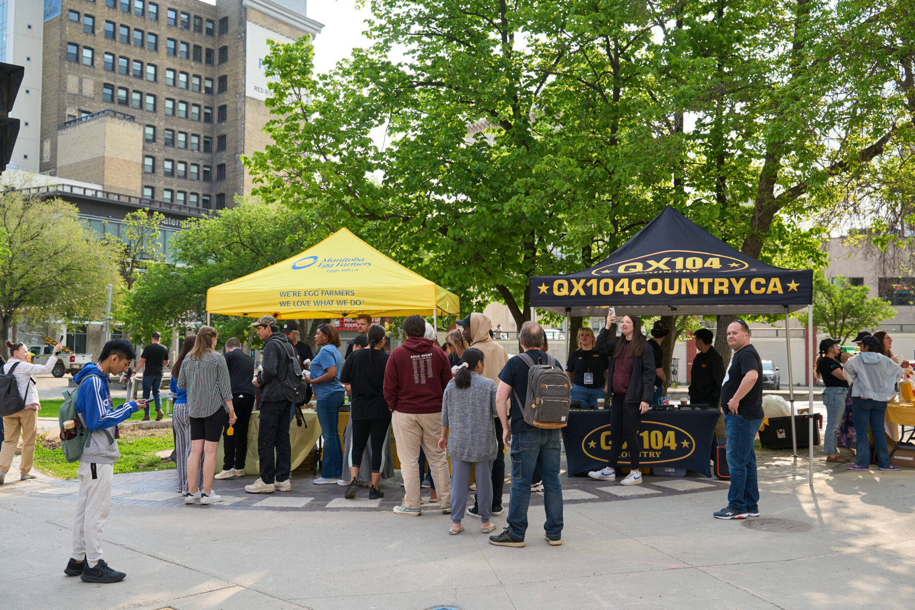 wide view of tents and lineup for egg giveaway