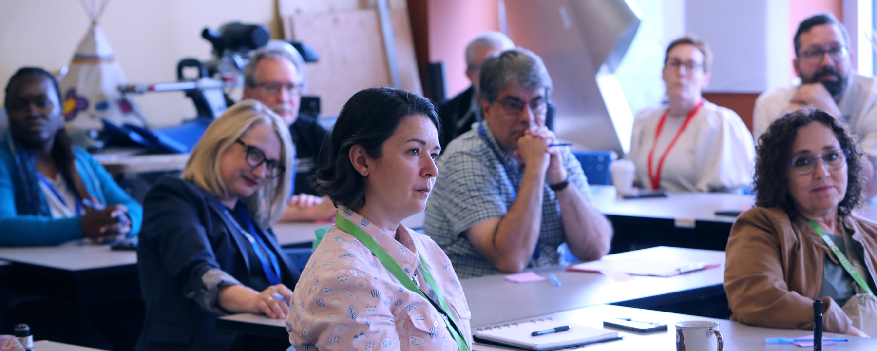 Staff members sitting in desks