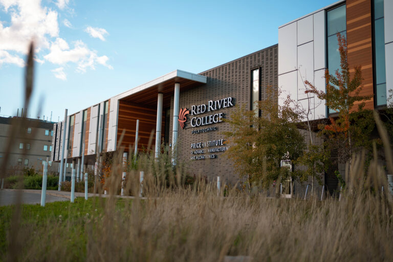 An image of RRC Polytech's Skilled Trades and Technology Centre, the building has the RRC logo and the words 'Price Institute of Advanced Manufacturing and Mechatronics