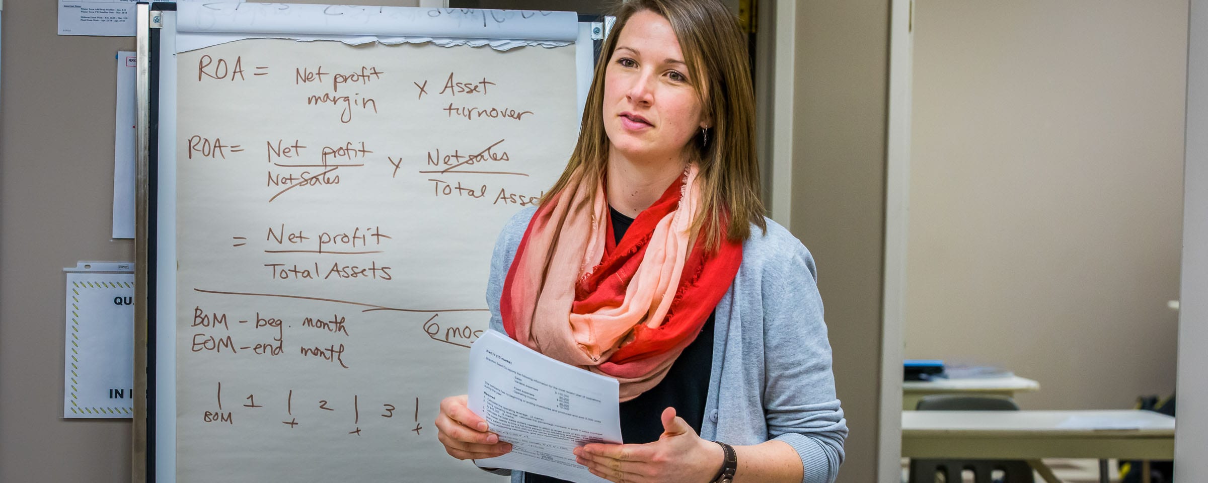 Teacher standing in front of a flipchart