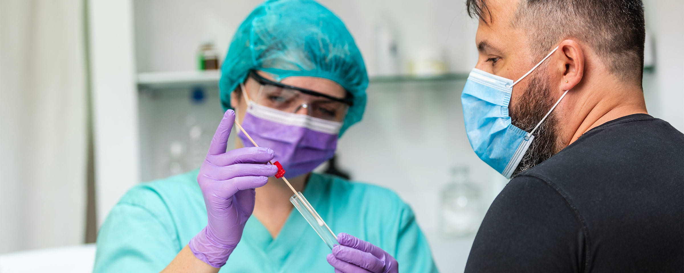 Nurse taking a swab of a patient