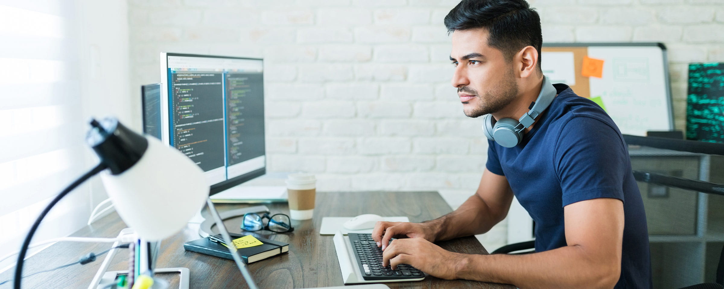 Man in home office working on a computer