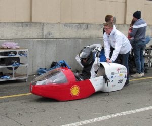 Students with battery-electric racer