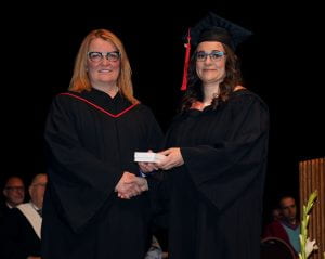 Janice Hyde (vice-chair, RRC Board of Governors) presents Michelle Queue with her Lieutenant Governor's Medal