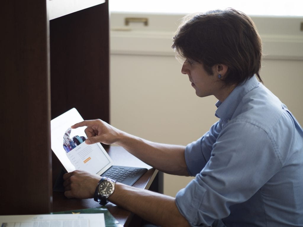 Male student working at desk