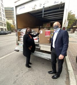 Keren Taylor-Hughes and Fred Meier lcading Winnipeg Harvest truck