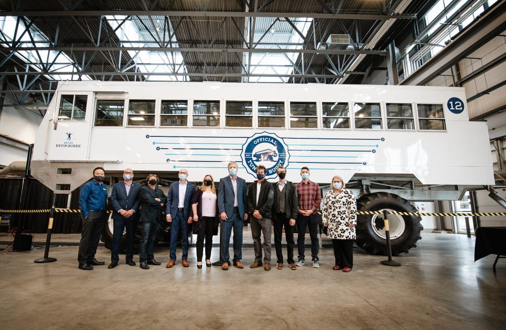 RRC Polytech staff and partners standing in front of Electric Vehicle (EV) Tundra Buggy