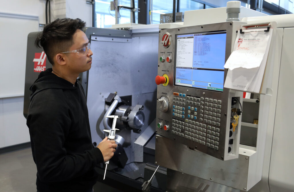 CNC machining student training on Haas equipment