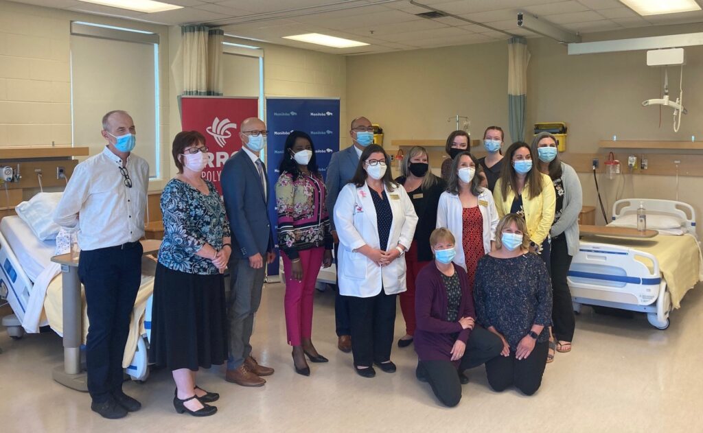 RRC Polytech students and staff, along with Fred Meier and provincial ministers, at media event in Nursing lab.