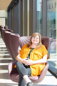 Science Laboratory Technology graduate Colleen Cottam-Birt, seated in chair