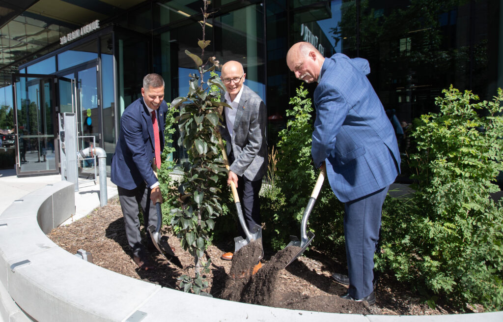 Mayor Brian Bowman, RRC Polytech PResident Brian Bowman and Assistant Deputy Minister Joe Funk turn soil at the College's Elgin Plaza opening.
