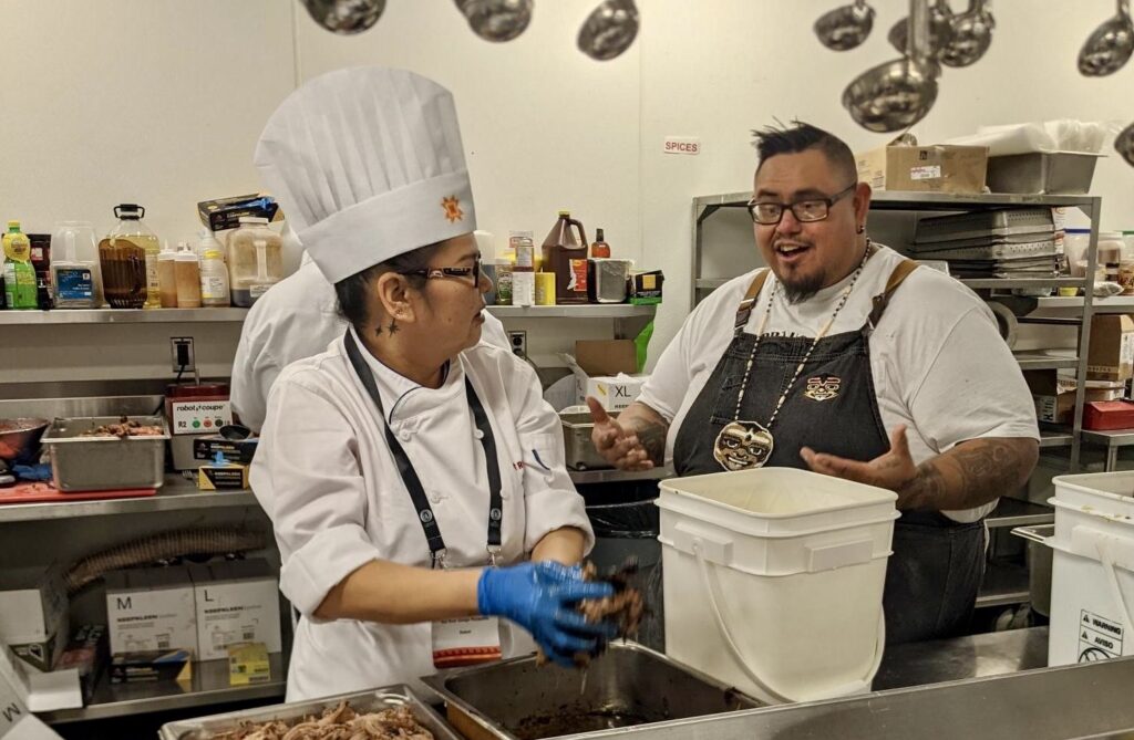 Culinary Skills students preparing food at the International Indigenous Tourism Conference in Winnipeg