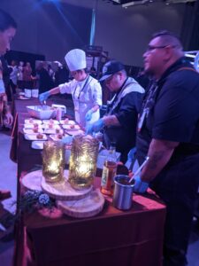 Culinary Skills students cooking at the International Indigenous Tourism Conference