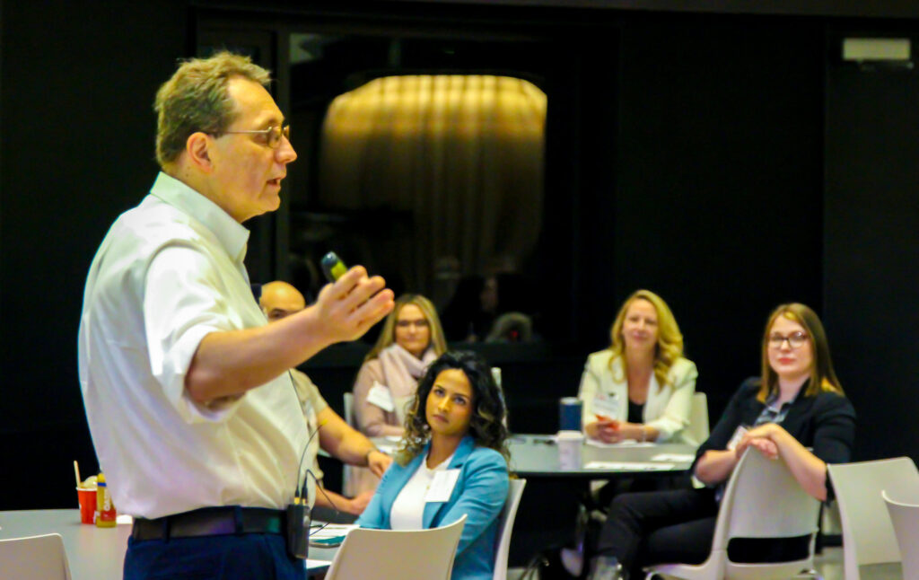 Conference attendees listening to a presenter