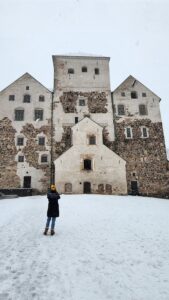 Student taking photo of historical building.