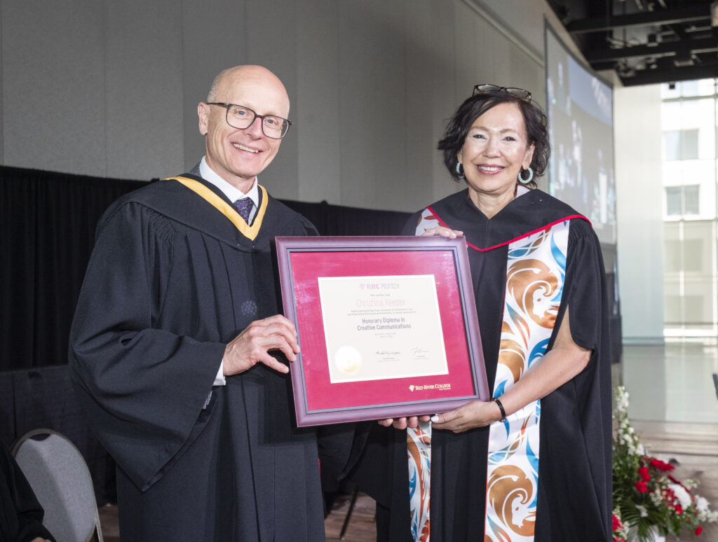 RRC Polytech president Fred Meier presents Tina Keeper with a framed honorary diploma at 2026 convocation ceremony.