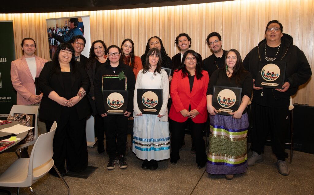 Indigenous entrepreneurs standing in two rows at closing ceremony of Mittohnee Pogo'ohtah.