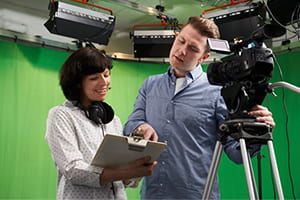 Man and woman working in the film industry