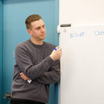 Man writing on a flip chart