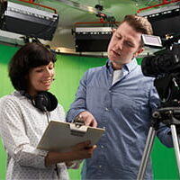 Man and woman working in the film industry
