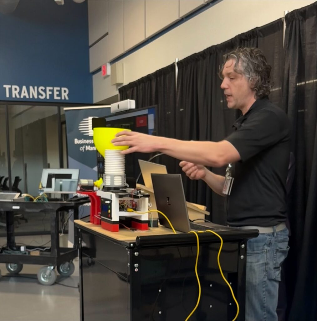a person demonstrates an automated food sorter 
