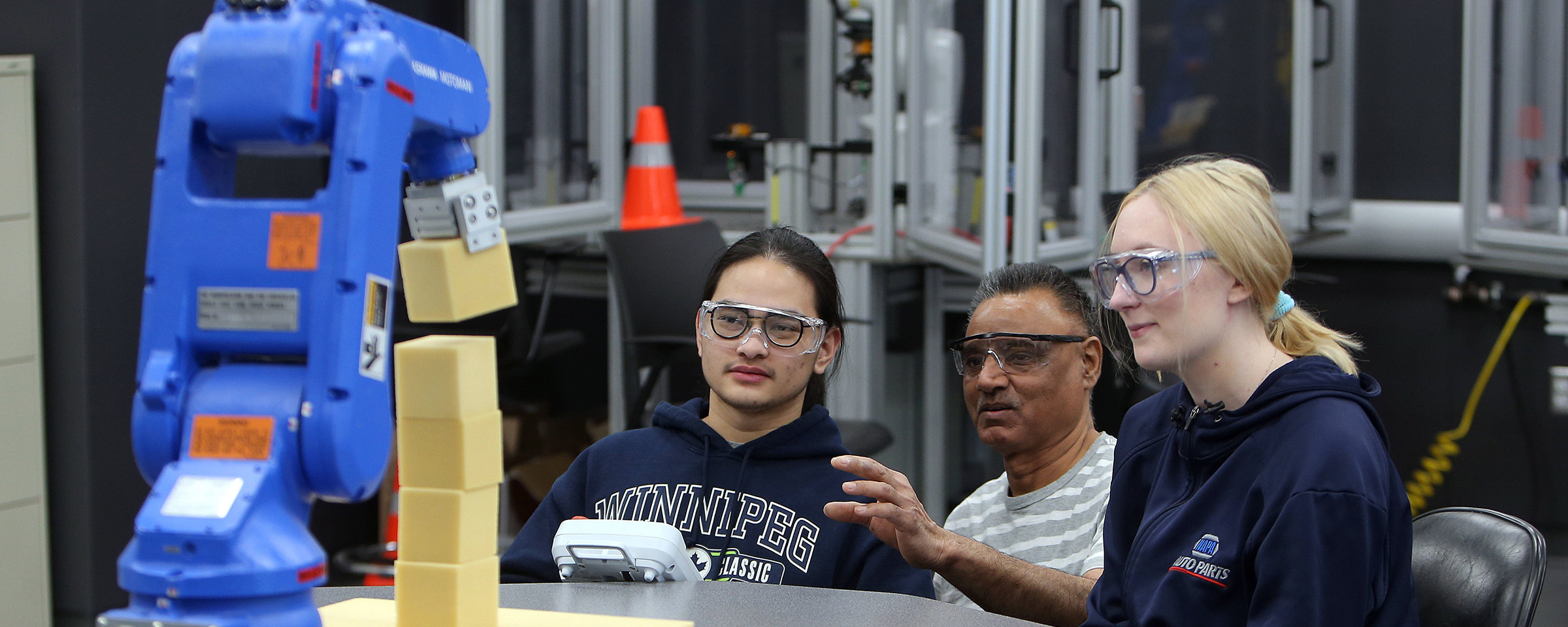 Students and instructor with machining equipment