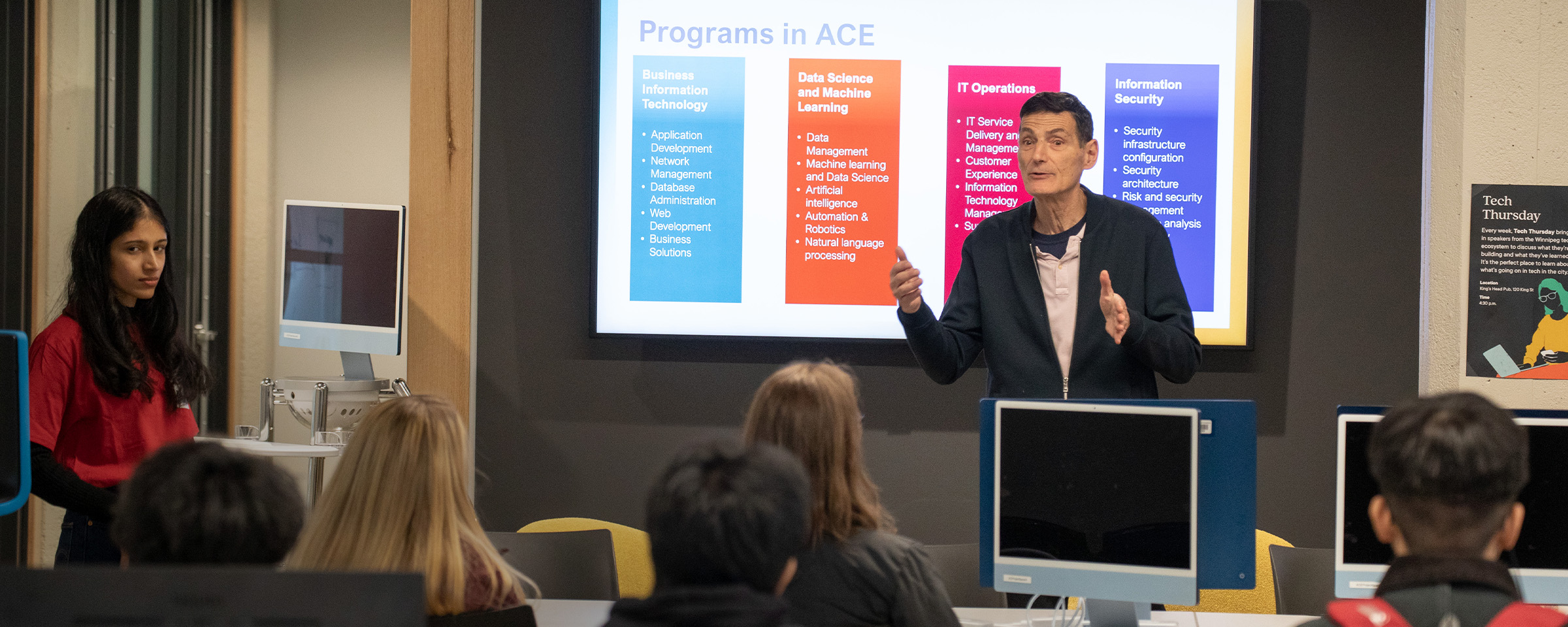 Instructor speaking to a classroom full of students