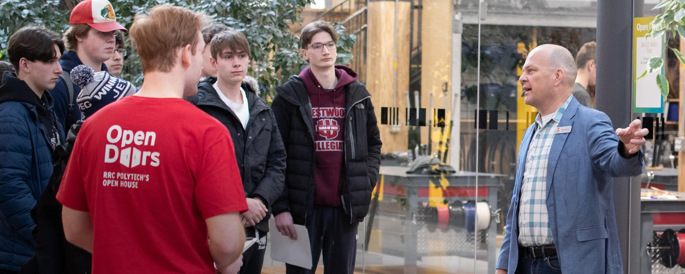 Group of students on a campus tour interacting with an instructor