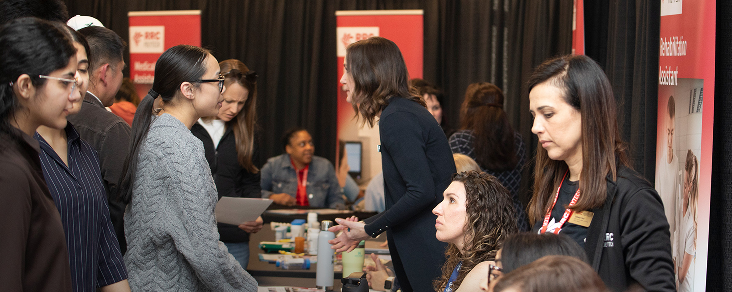 People milling about at a college open house