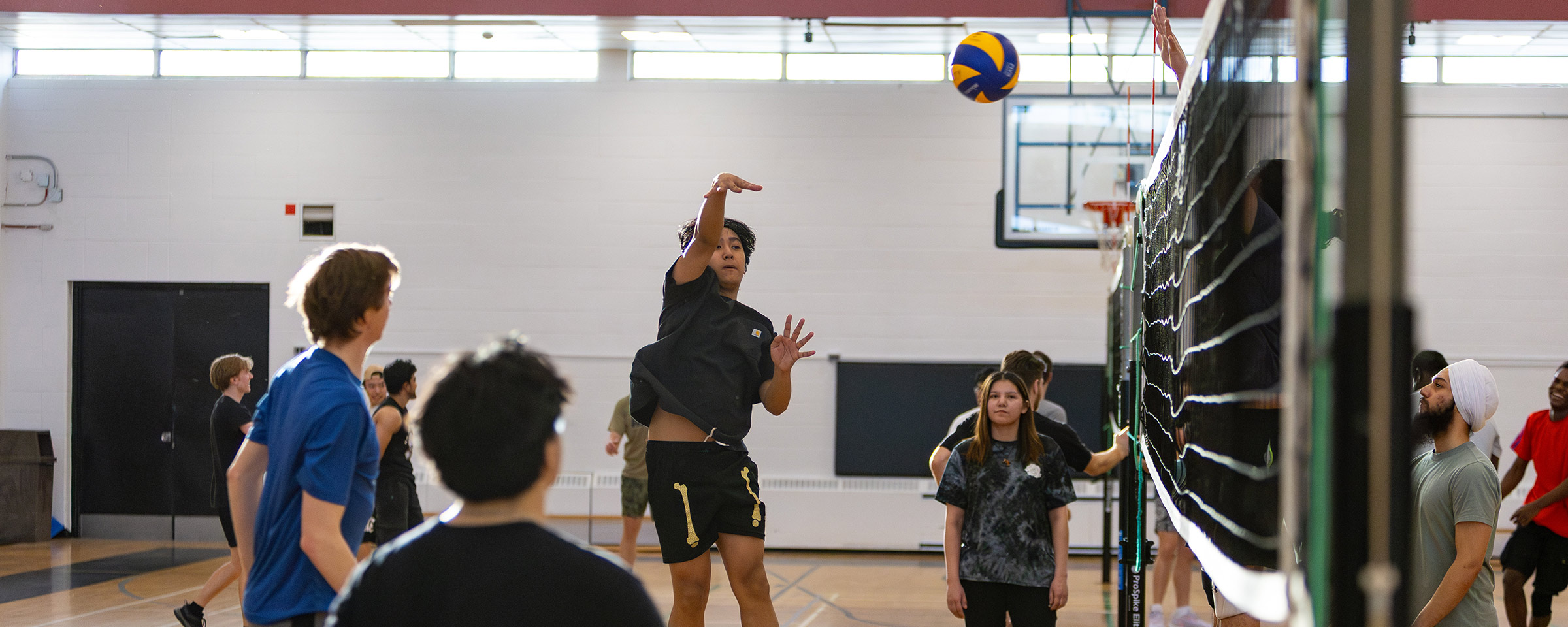 Student playing volleyball