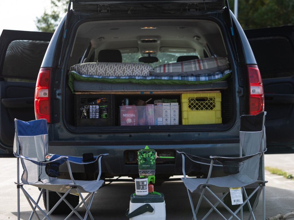 Back of a camper van loaded for a road trip