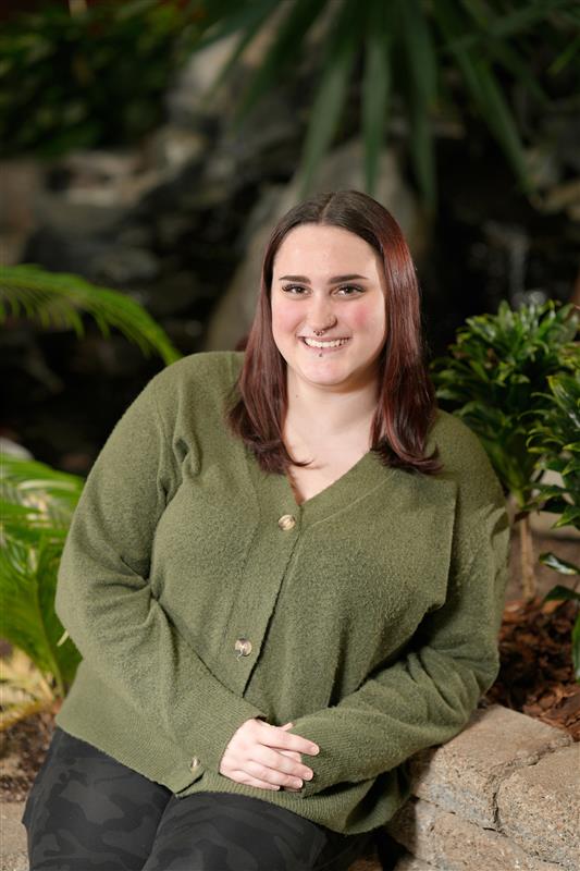 Photo of female student in green sweater