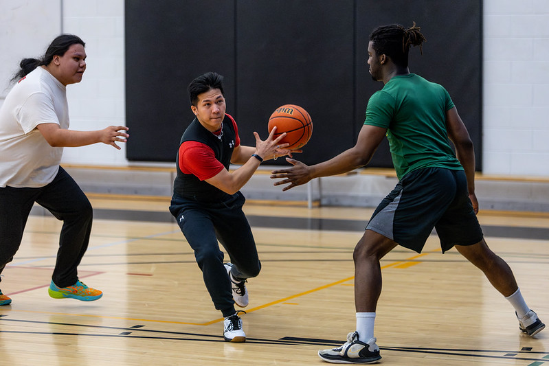 Friends playing basketball