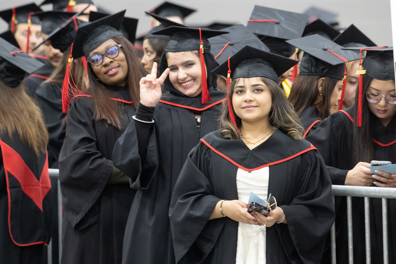 Group of RRC graduates in their caps and gowns.