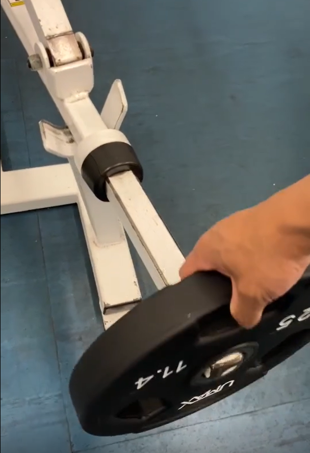 Picture of weight going on the weight horn of the plate loaded chest supported row