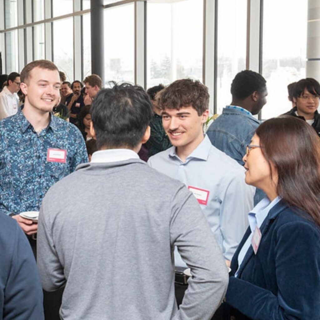 Group of students mingling and meeting each other.