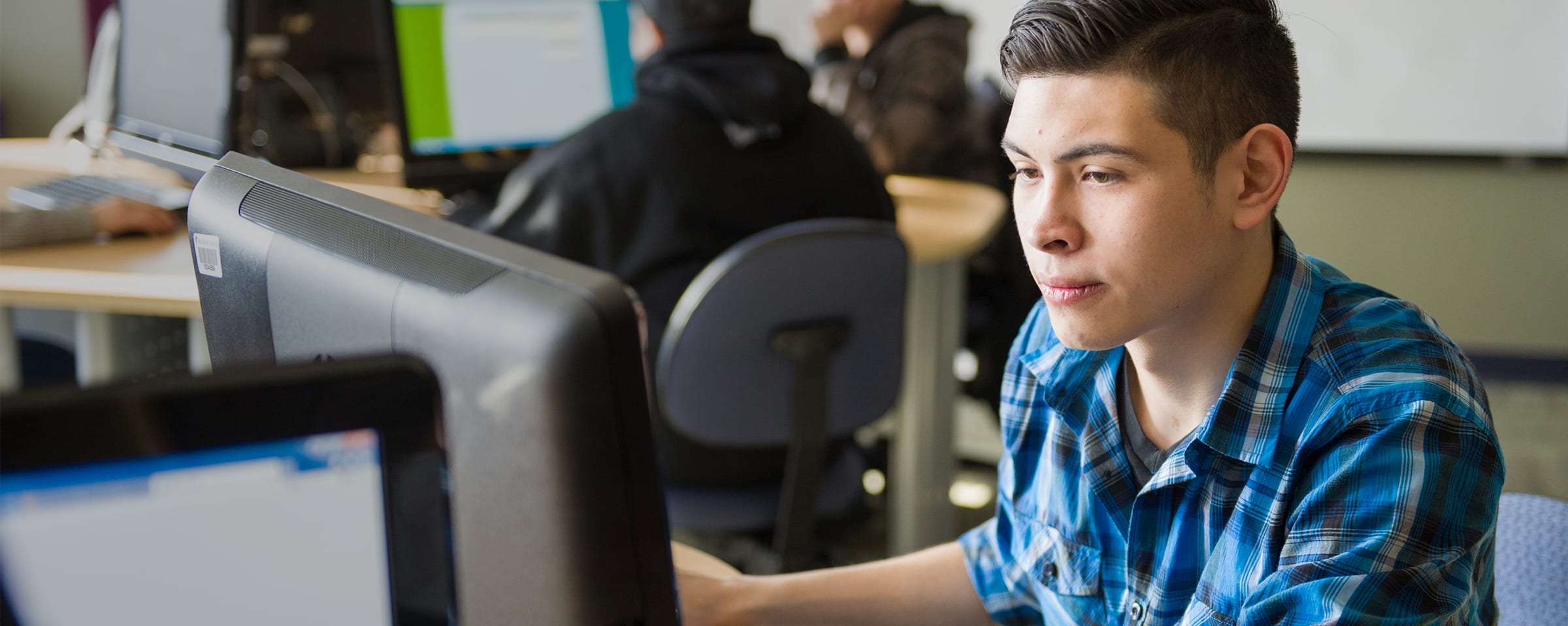 Male Indigenous student in computer lab