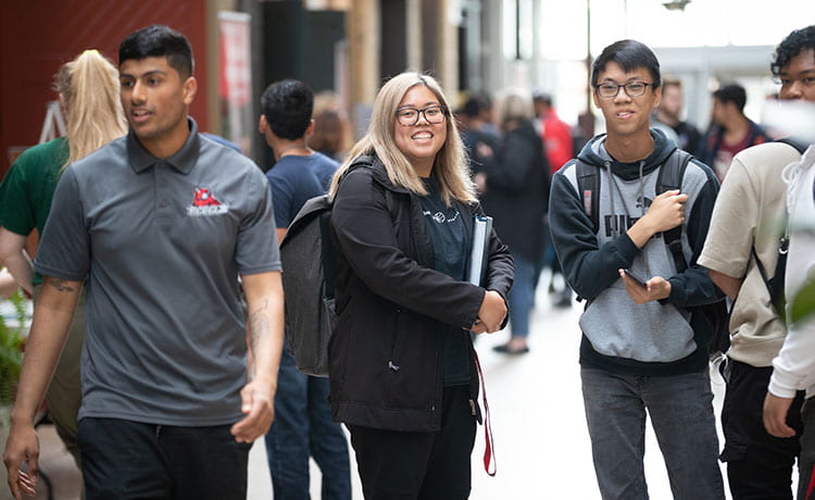 Students walking in atrium