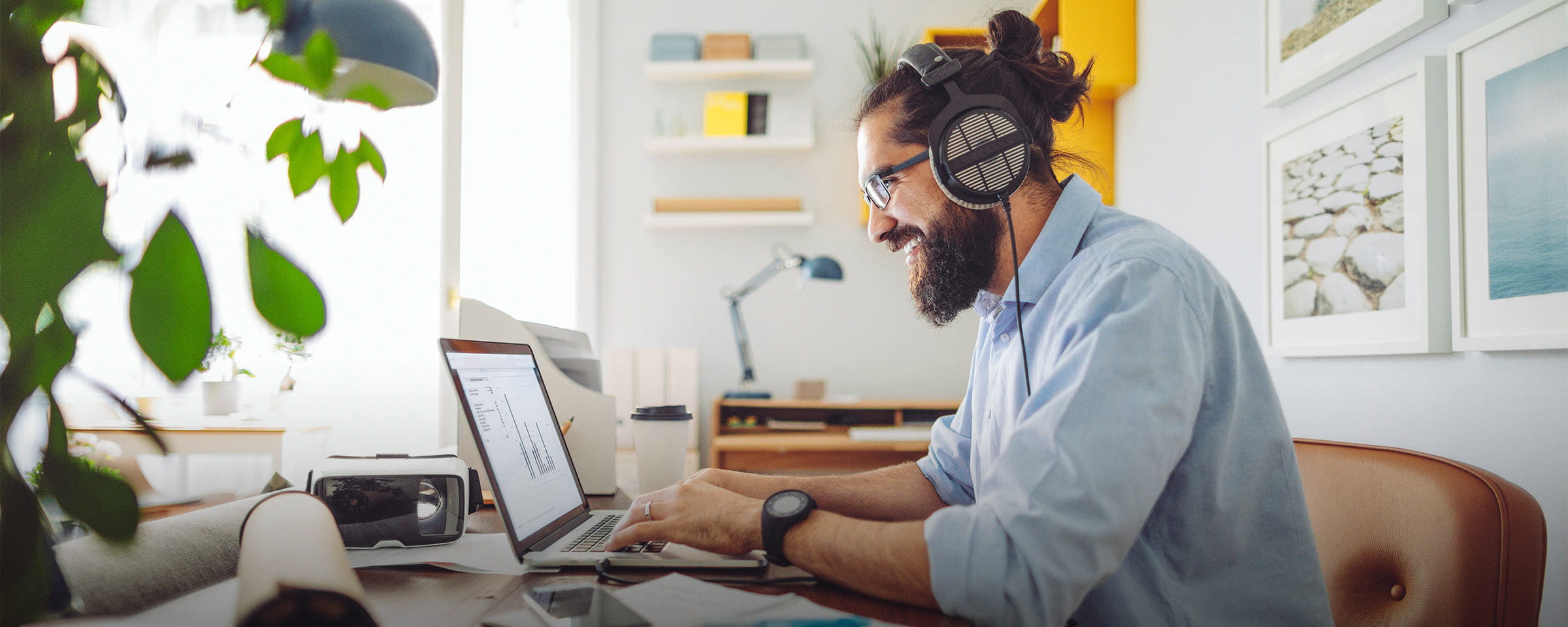 Man at laptop with headphones