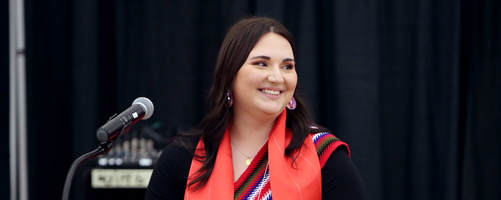 students with Métis sash at her convocation.  
