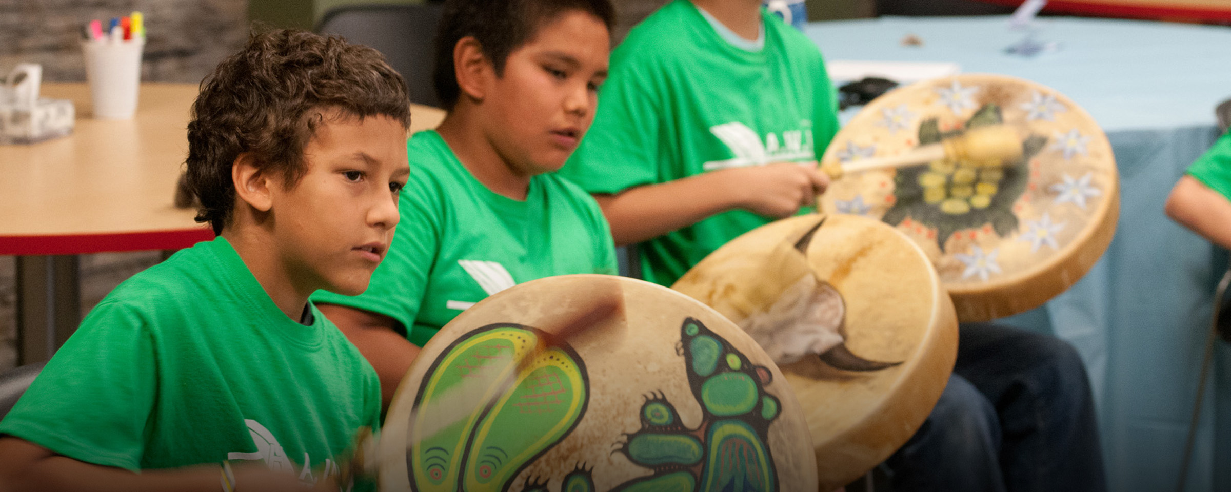 Boys drumming as part of Indigenous summer youth camp