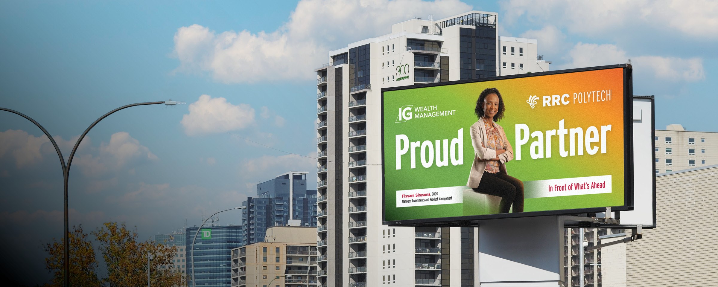 Winnipeg skyline with "Proud Partner" billboard of RRC Polytech graduate Fisyani Sinyama.
