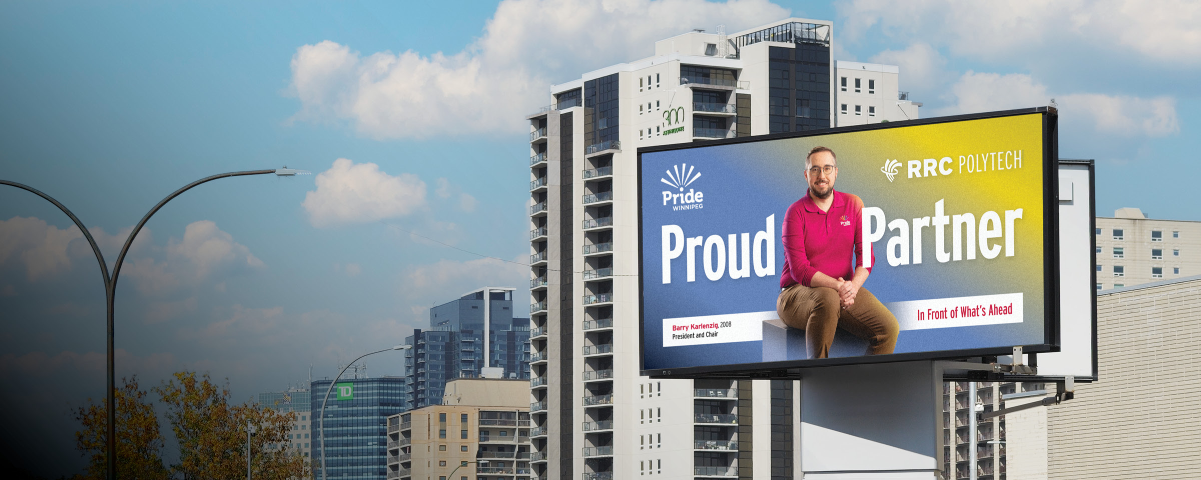 Winnipeg skyline with "Proud Partner" billboard of RRC Polytech graduate Barry Karlenzig.