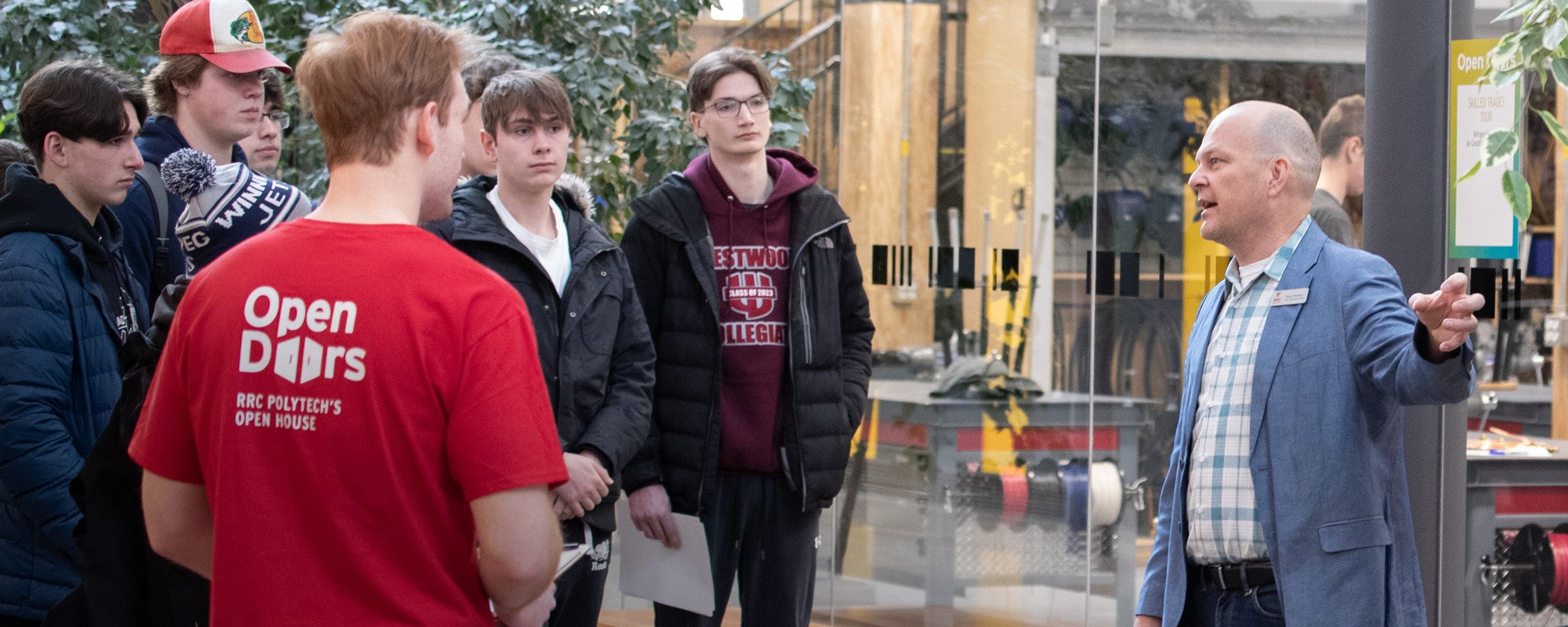 Instructor talking to high school students on Open Doors tour of campus.
