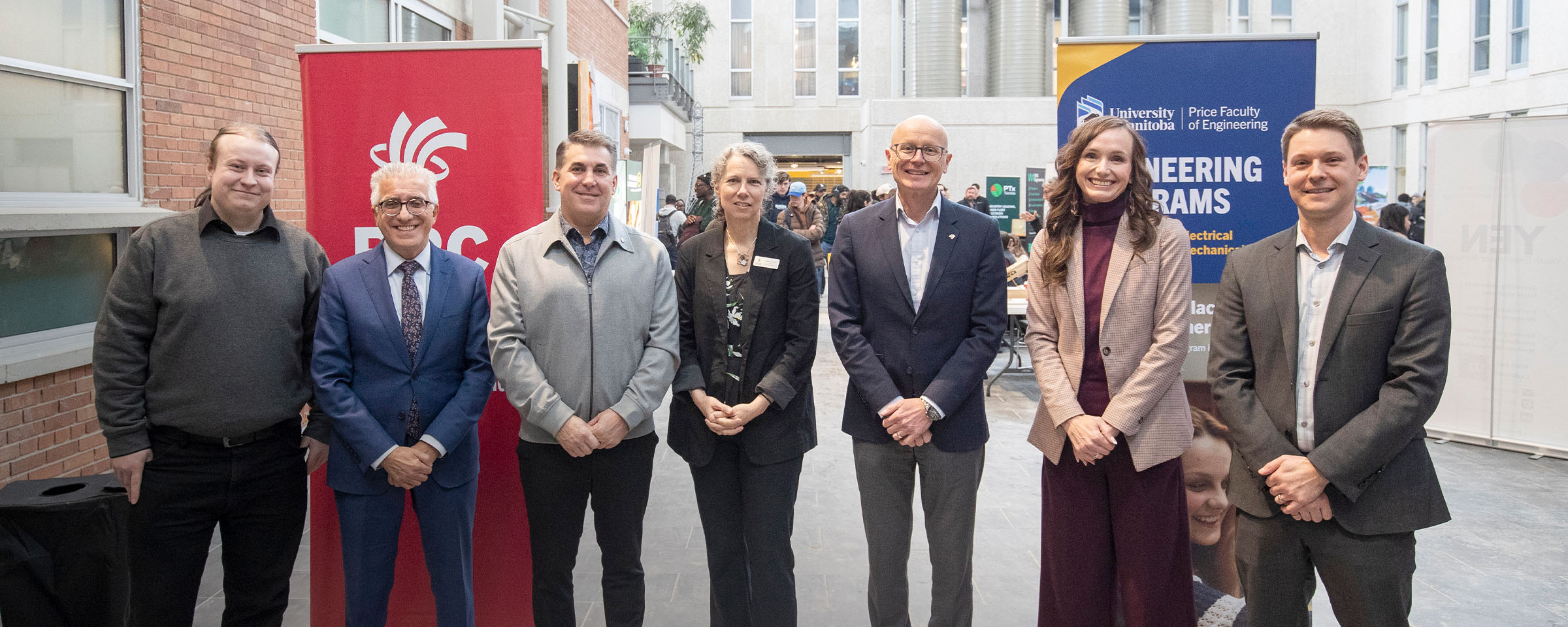 Group shot of RRC Polytech and University of Manitoba stakeholders standing in a line.