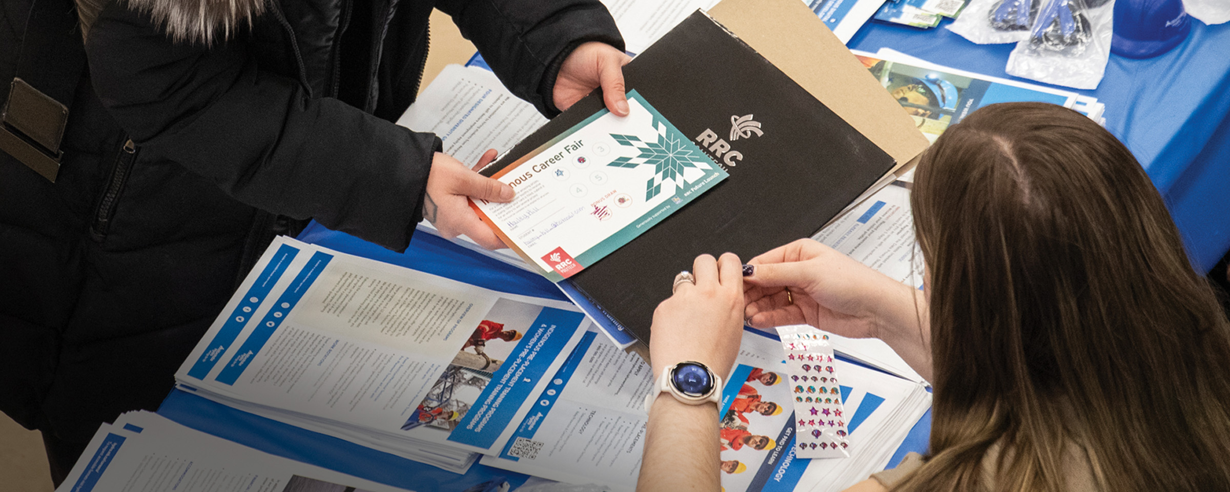 Closeup of networking stamp being applied to printed passport at Indigenous Career Fair 2025.